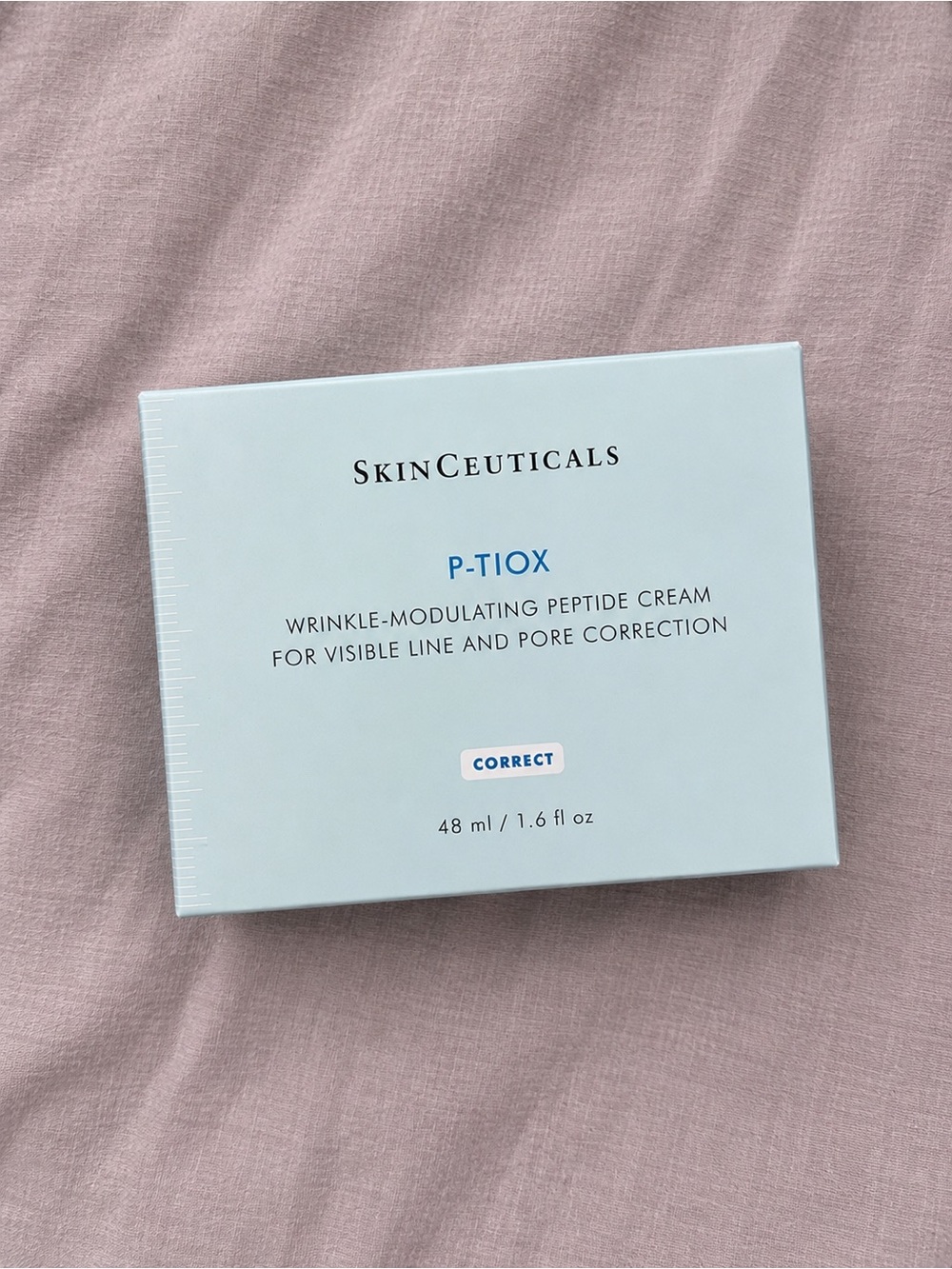 SkinCeuticals P-Tiox Peptide Cream — Light Blue Box on Pink